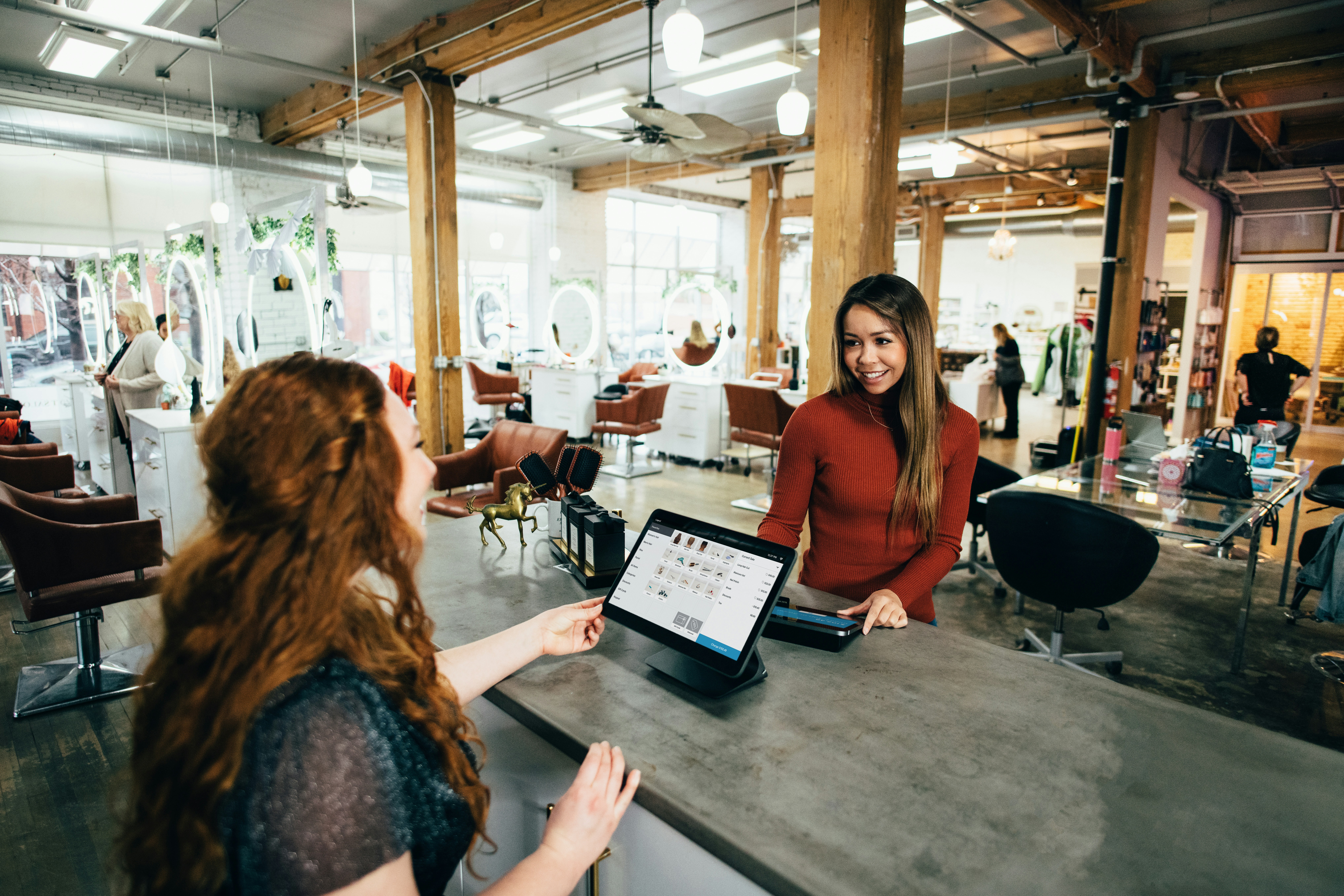 Business Owner in her shop that she has small business insurance for