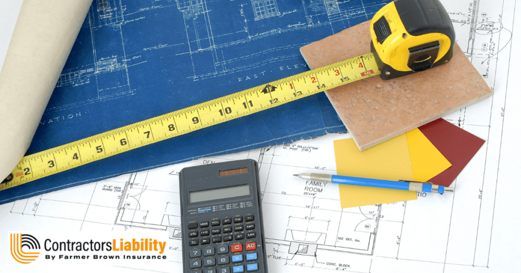 Blueprints with a tape measure, calculator, pencil, and material samples for estimating construction costs.