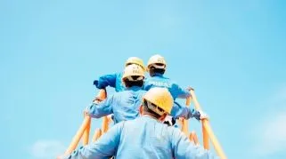 workers climbing up a ladder