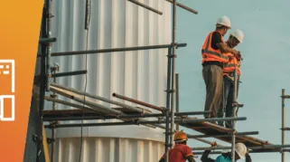 Construction worker on a job site with a shield icon representing contractors liability insurance coverage