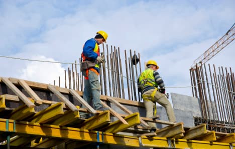 workers-examining-work